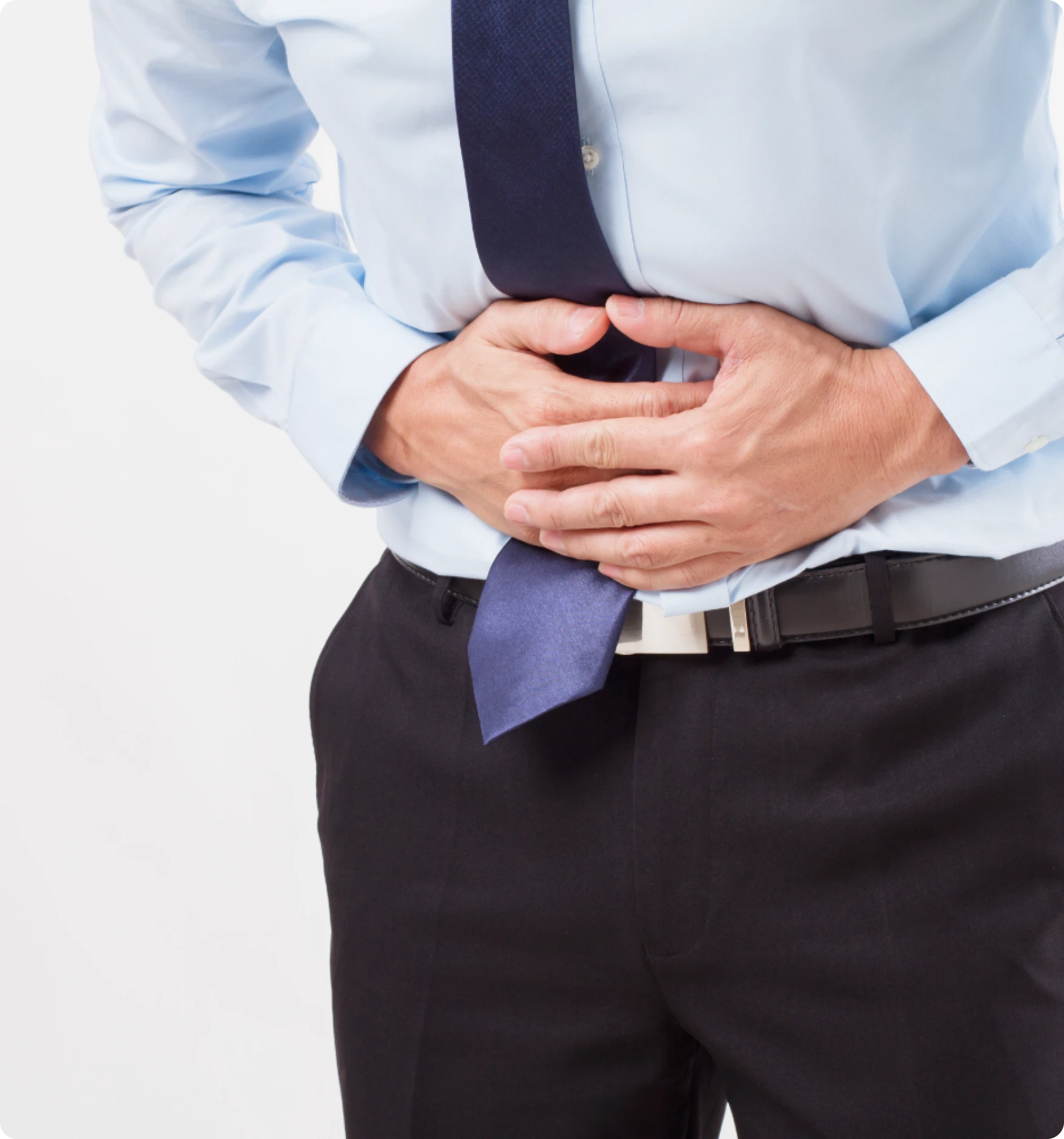 Man experiencing abdominal discomfort, a potential symptom that warrants colon cancer screening with Cologuard.